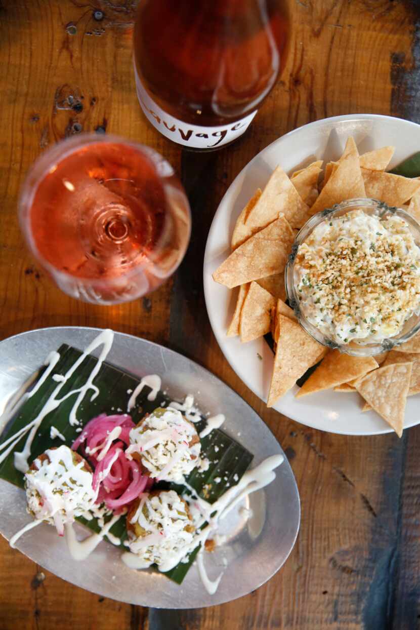 Spicy tamale bites (bottom) and jalapeño artichoke dip paired with Sauvage Zero Dosage Rose.