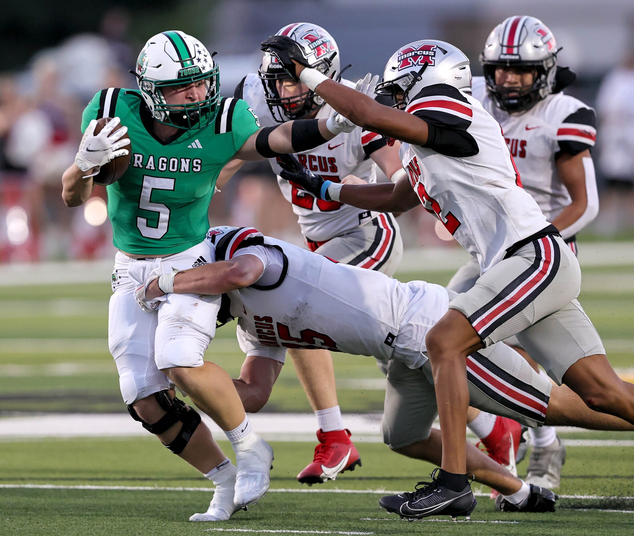 Southlake Carroll running back James Lehman (5) breaks free for a big run against Flower...