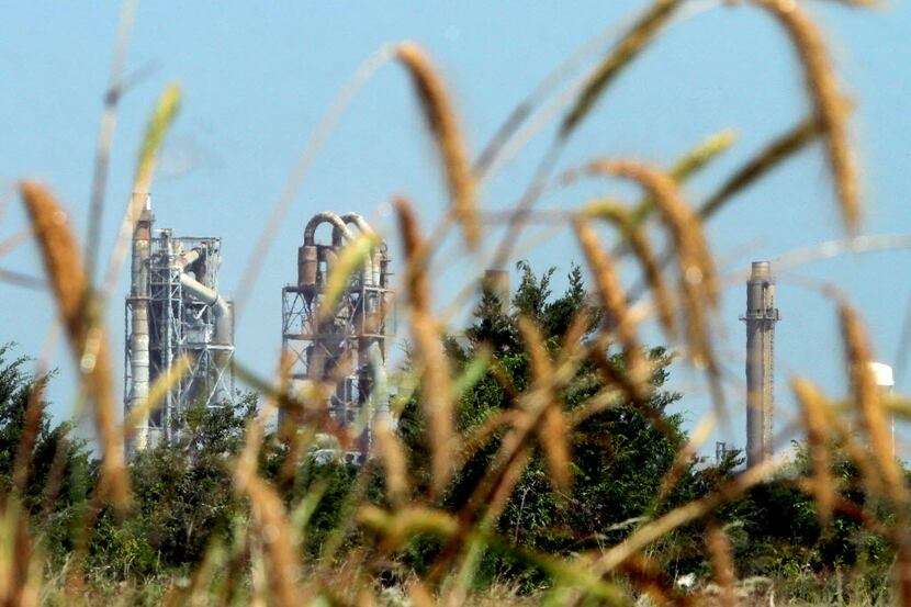 The Holcim Cement Plant is neighbor to the Mockingbird Nature Park as seen from one of the...