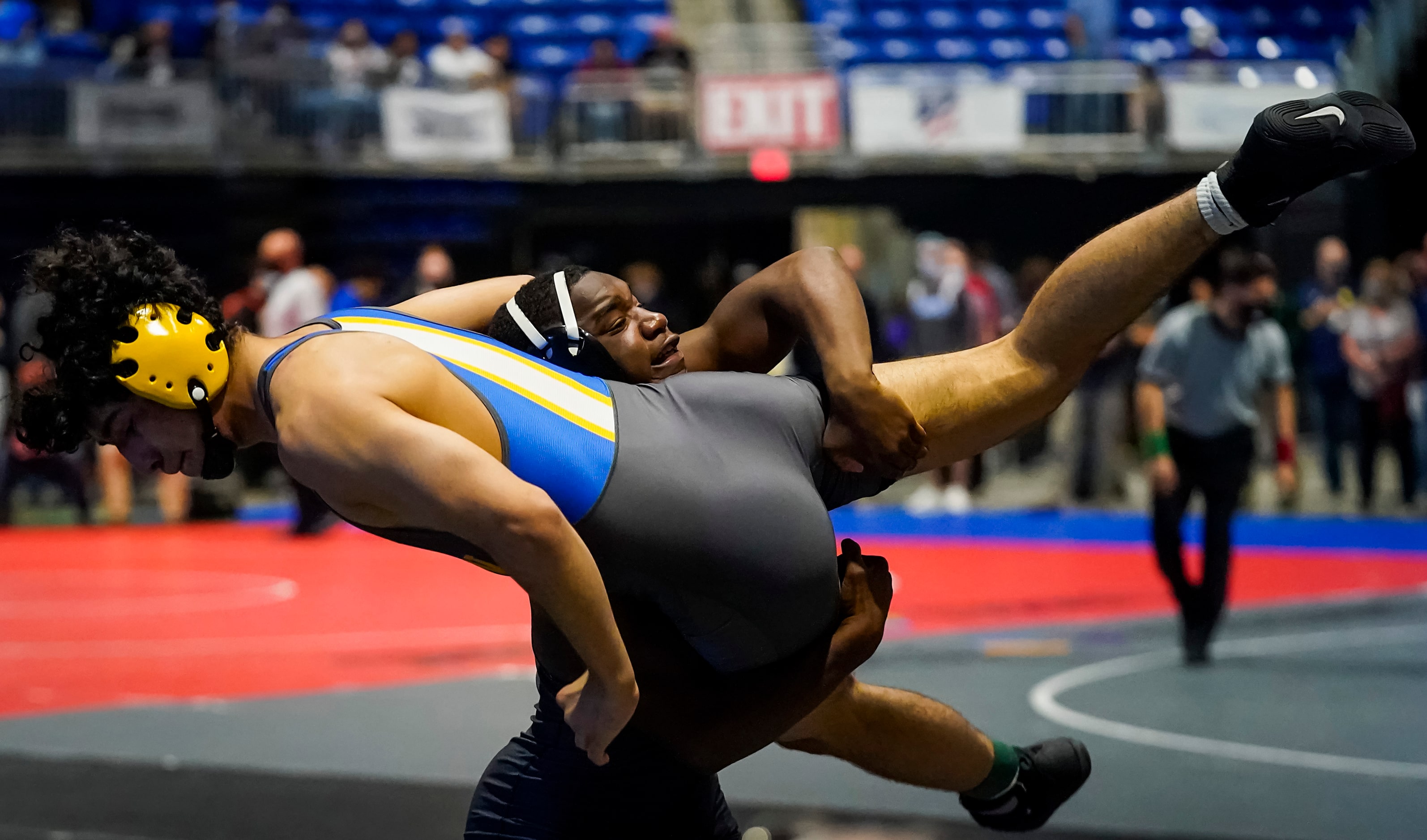 Donavan Whitted of Arlington Martin (facing) wrestles Roberto Bautista of Klein for the 6A...