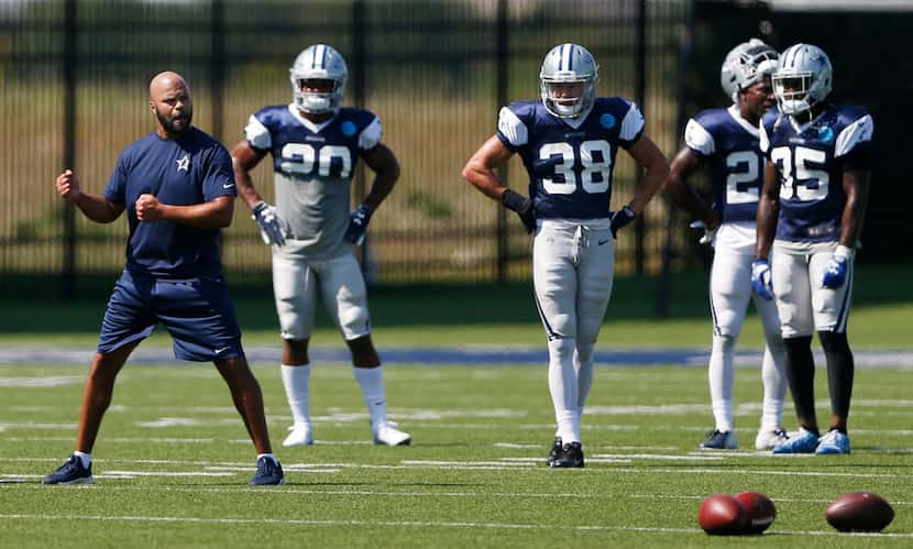 Dallas Cowboys passing game coordinator and defensive backs coach Kris Richard instructs...