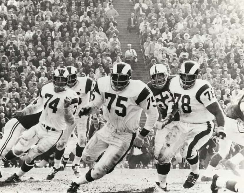 In this Dec. 17, 1967 photo provided by NFL Photos, Los Angeles Rams defensive David...