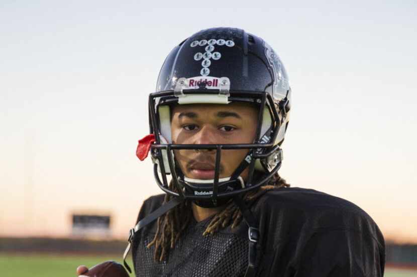 Quarterback Jett Duffey poses for a photo on Wednesday, December 16, 2015 at Mansfield Lake...