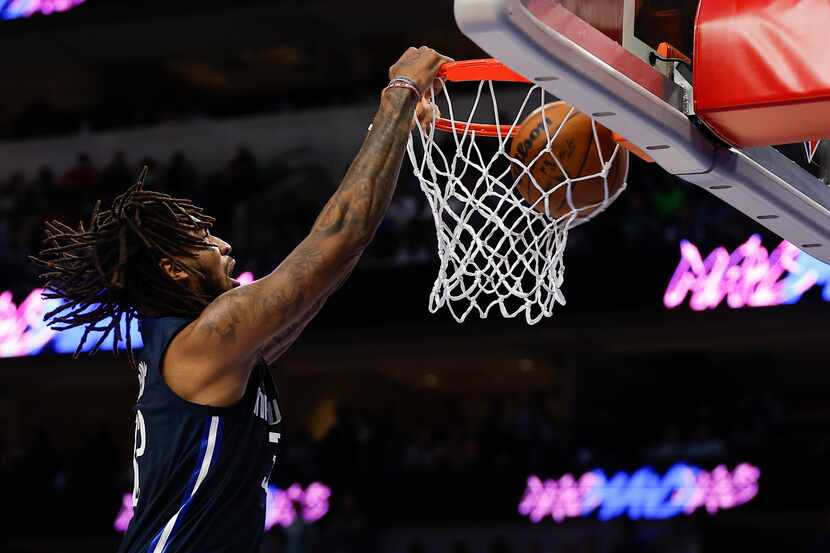 Dallas Mavericks forward Marquese Chriss dunks during the second half of an NBA basketball...