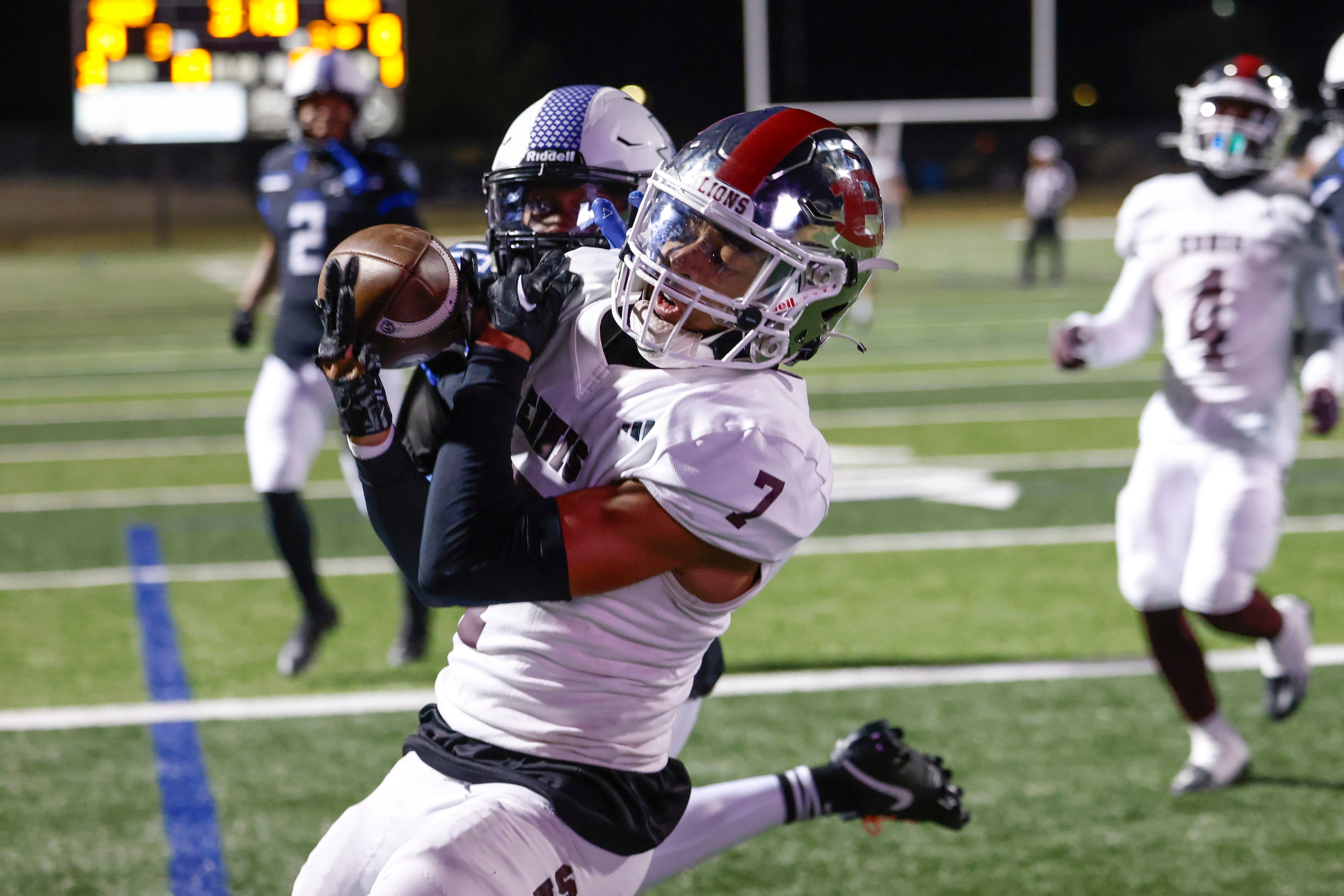 Mansfield Summit High’s Davaughn Sille (back) breaks up a pass intended for Ennis High...