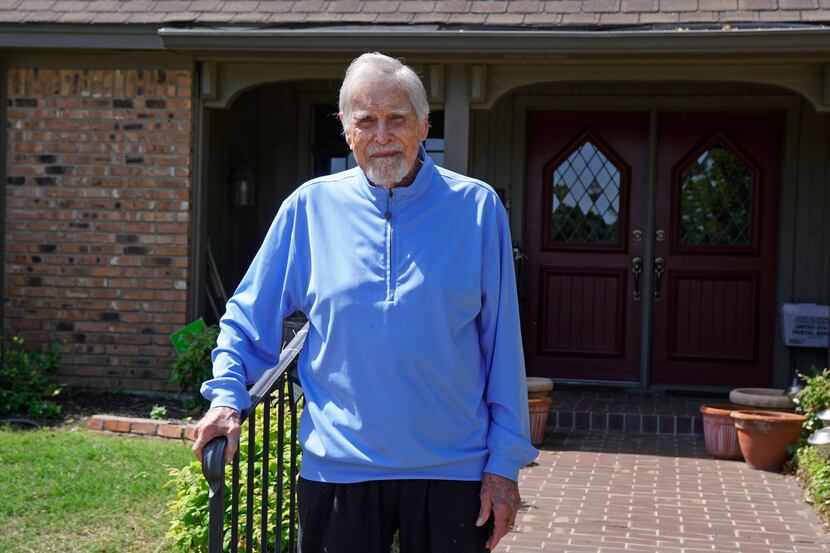 Eddie Robinson stands on the front steps of his home in Fort Worth. He is the oldest retired...