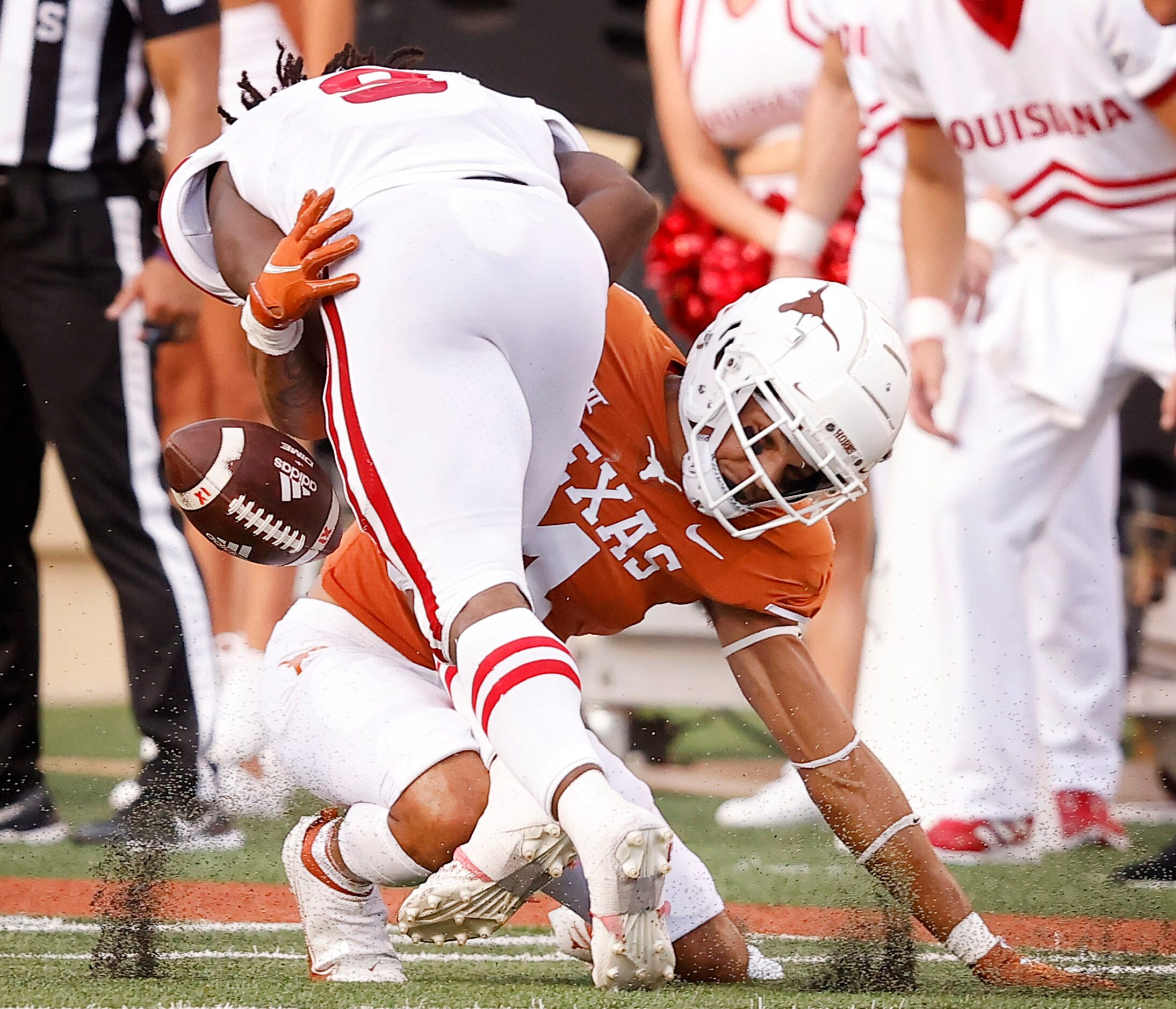 Texas Longhorns defensive back Darion Dunn (4) forces Louisiana-Lafayette Ragin Cajuns...