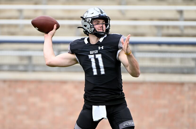 Denton Guyer's Jackson Arnold (11) passes in the first half of a Class 6A Division II Region...