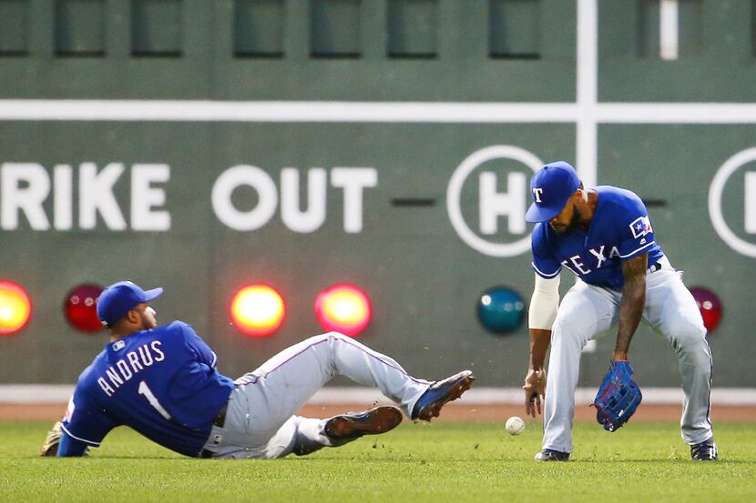 BOSTON, MA - MAY 23:  Elvis Andrus #1 and Delino DeShields #3 of the Texas Rangers miss a...