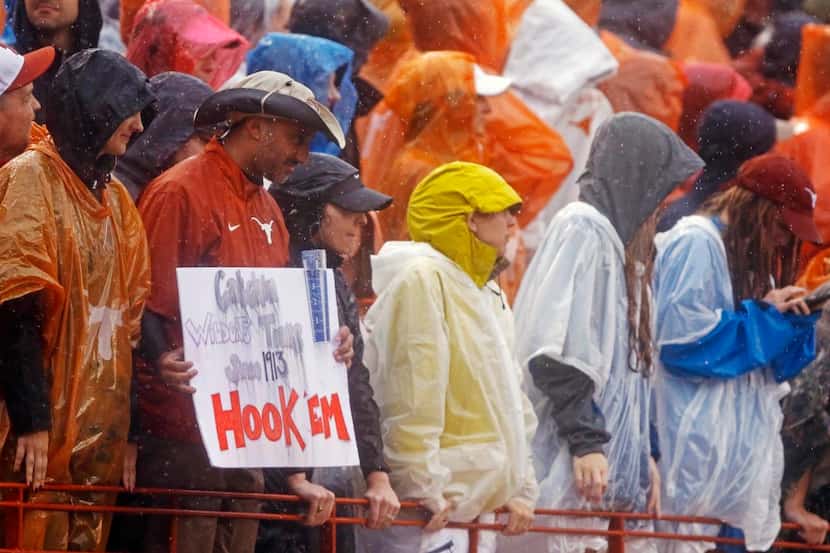 It was hard to keep signs  or anything else dry at the University of Texas game against...