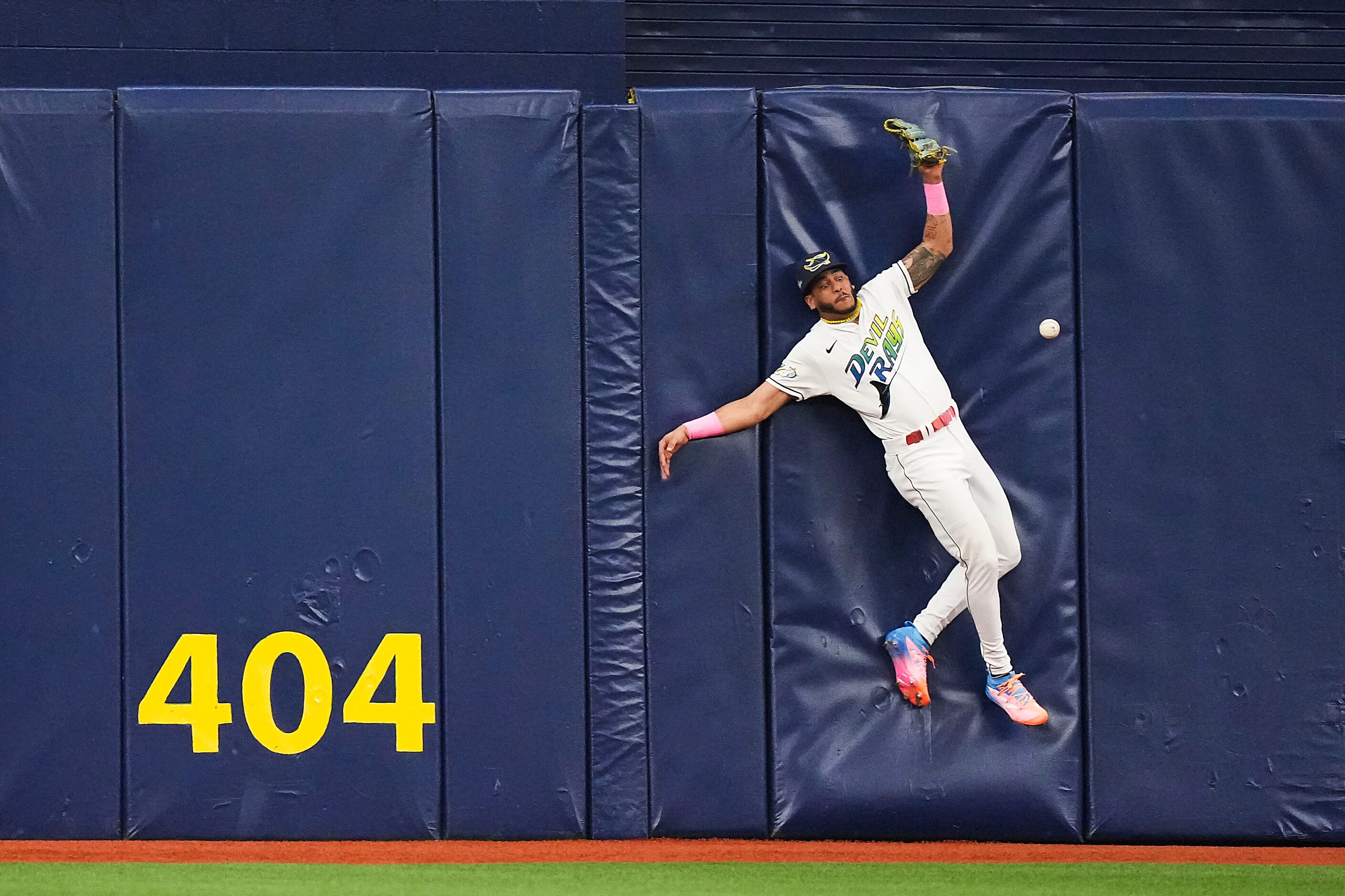 Tampa Bay Rays center fielder Jose Siri can’t make a catch on a leadoff double off the bat...