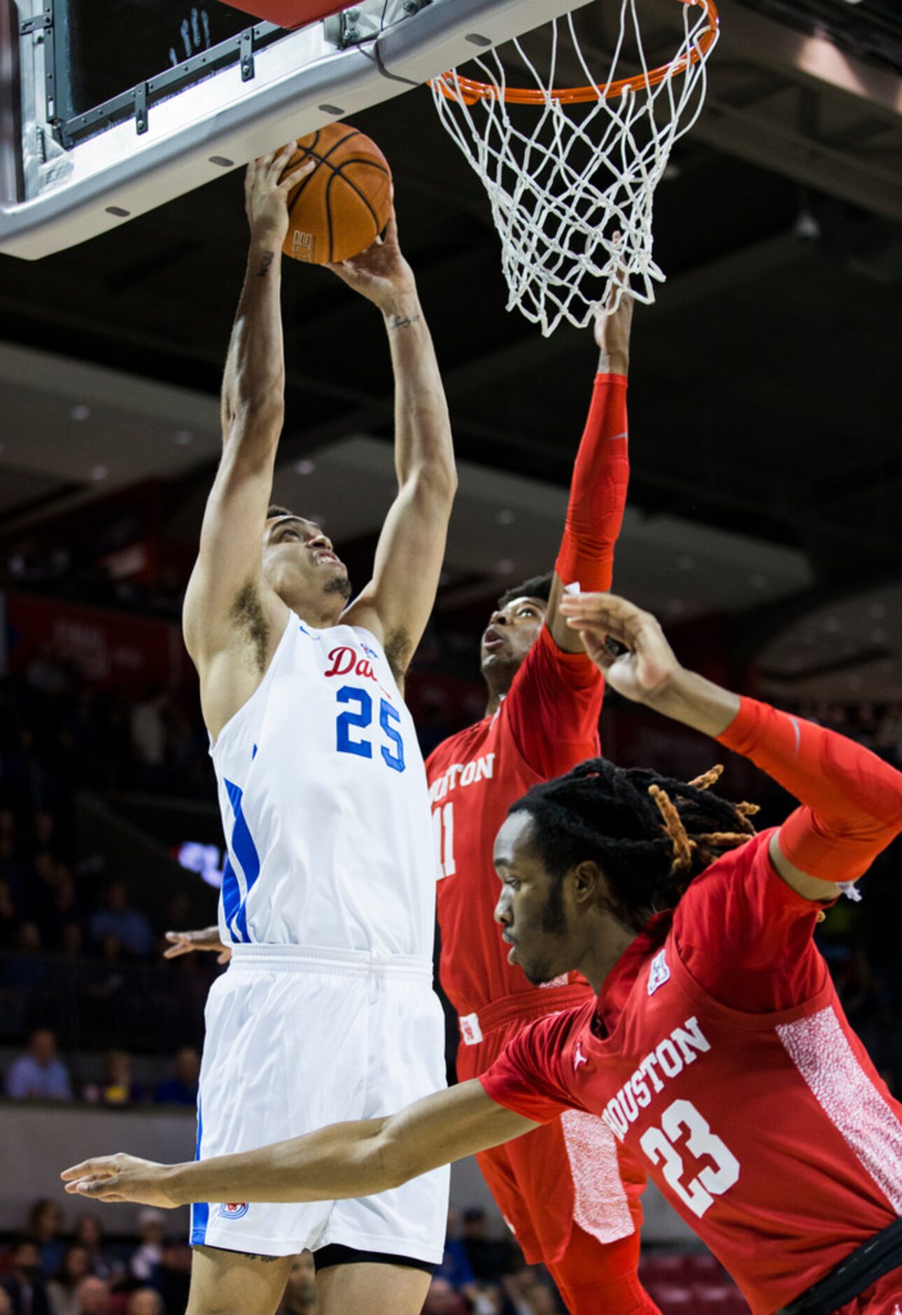 Southern Methodist Mustangs forward Ethan Chargois (25) dunks the ball during the first half...