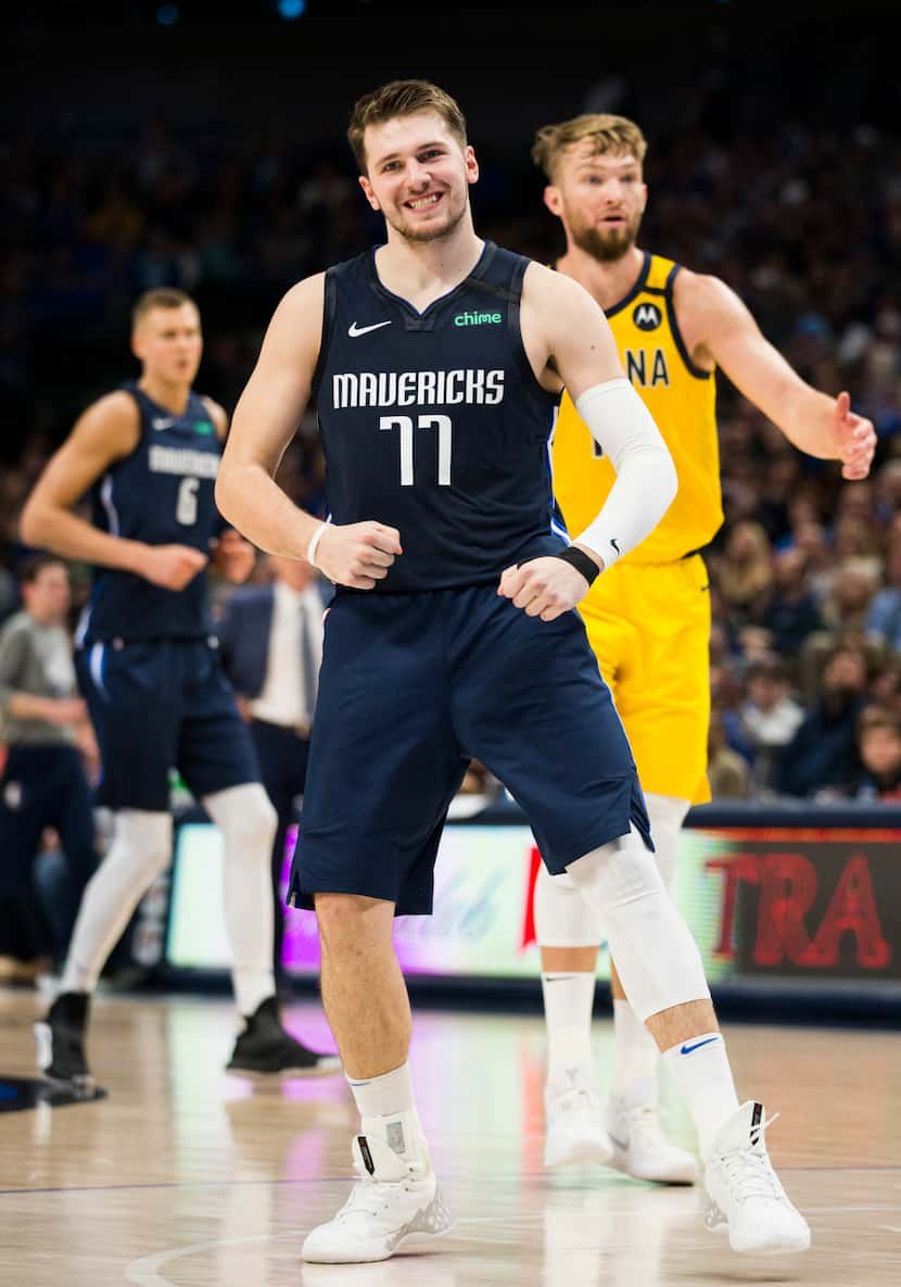 Dallas Mavericks guard Luka Doncic (77) celebrates a point during the fourth quarter of an...