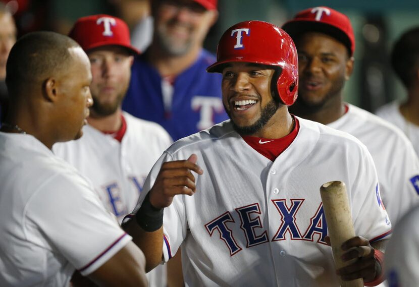 Texas Rangers third baseman Adrian Beltre (left) stares down shortstop Elvis Andrus as...