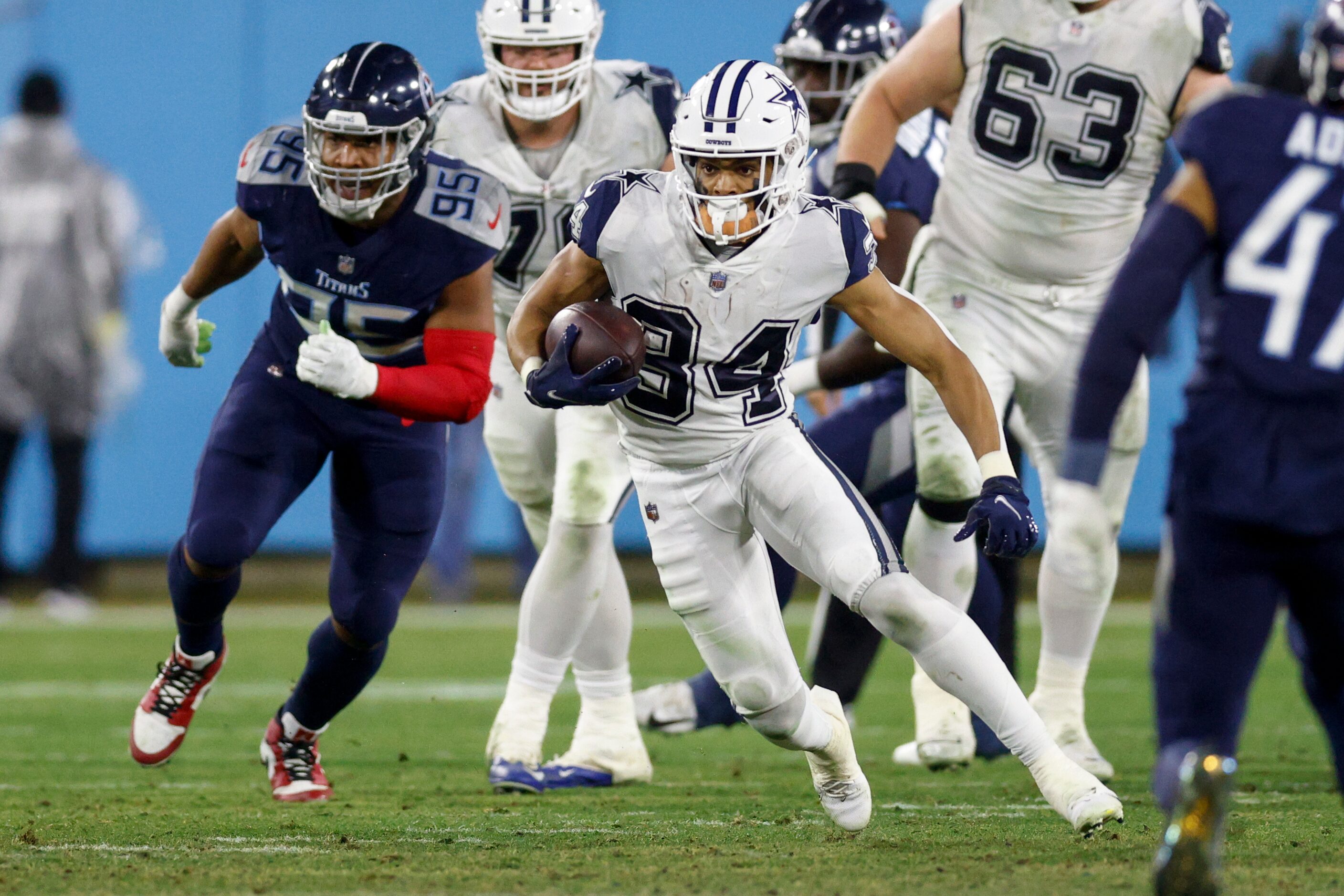 Dallas Cowboys running back Malik Davis (34) runs down field during the first half of an NFL...