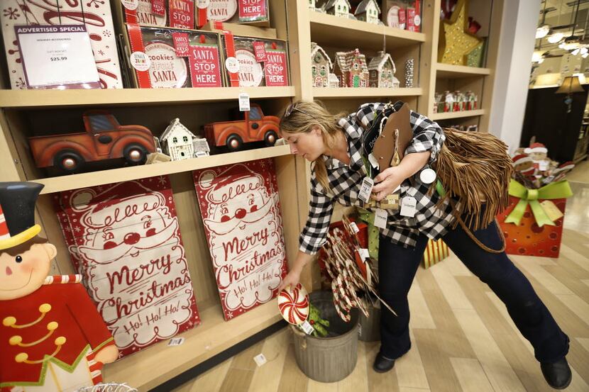 A shopper in the holiday decor merchandise area at Nebraska Furniture Mart in  2015. (File...