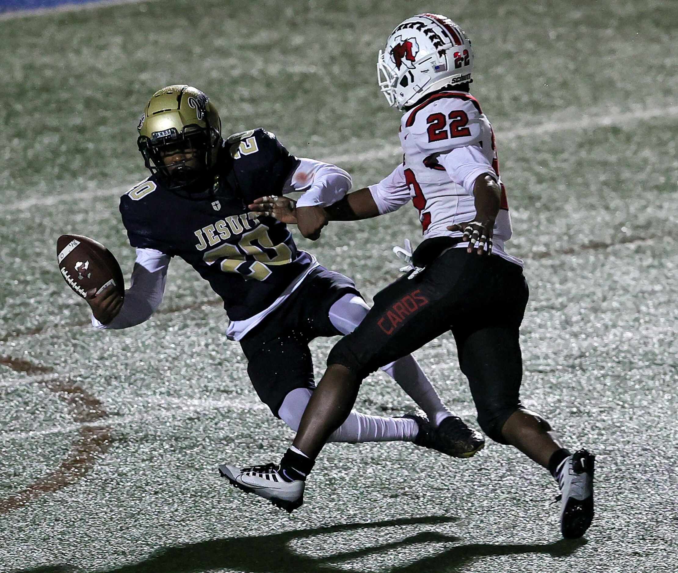 Jesuit defensive back Sean Watson (20) can't come up with an interception against MacArthur...