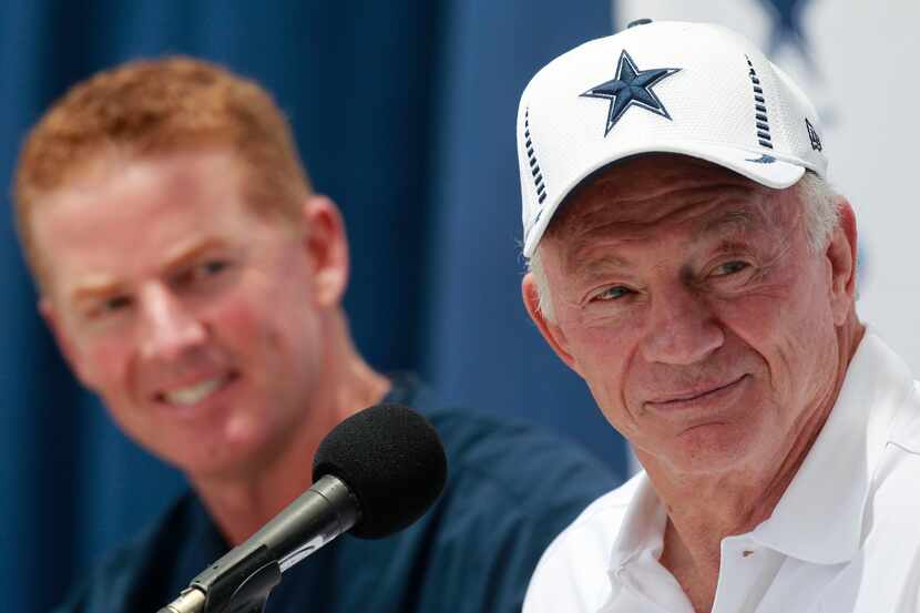 Dallas Cowboys coach Jason Garrett and owner Jerry Jones laugh at a press conference at...