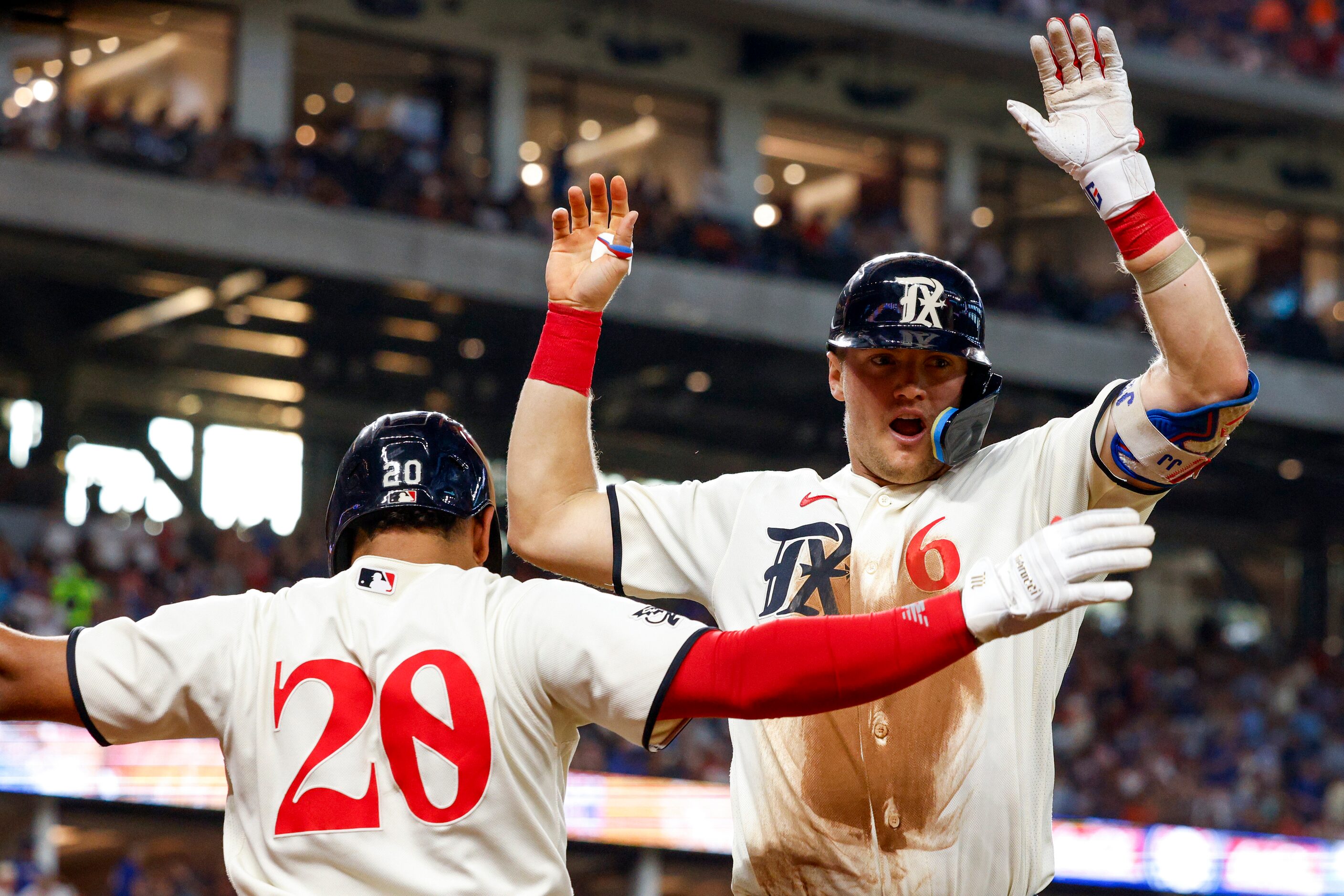 Texas Rangers third baseman Josh Jung (6) celebrates his home run with designated hitter...