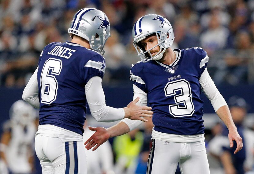 Dallas Cowboys holder Chris Jones (6) congratulates new kicker Kai Forbath (3) on his second...