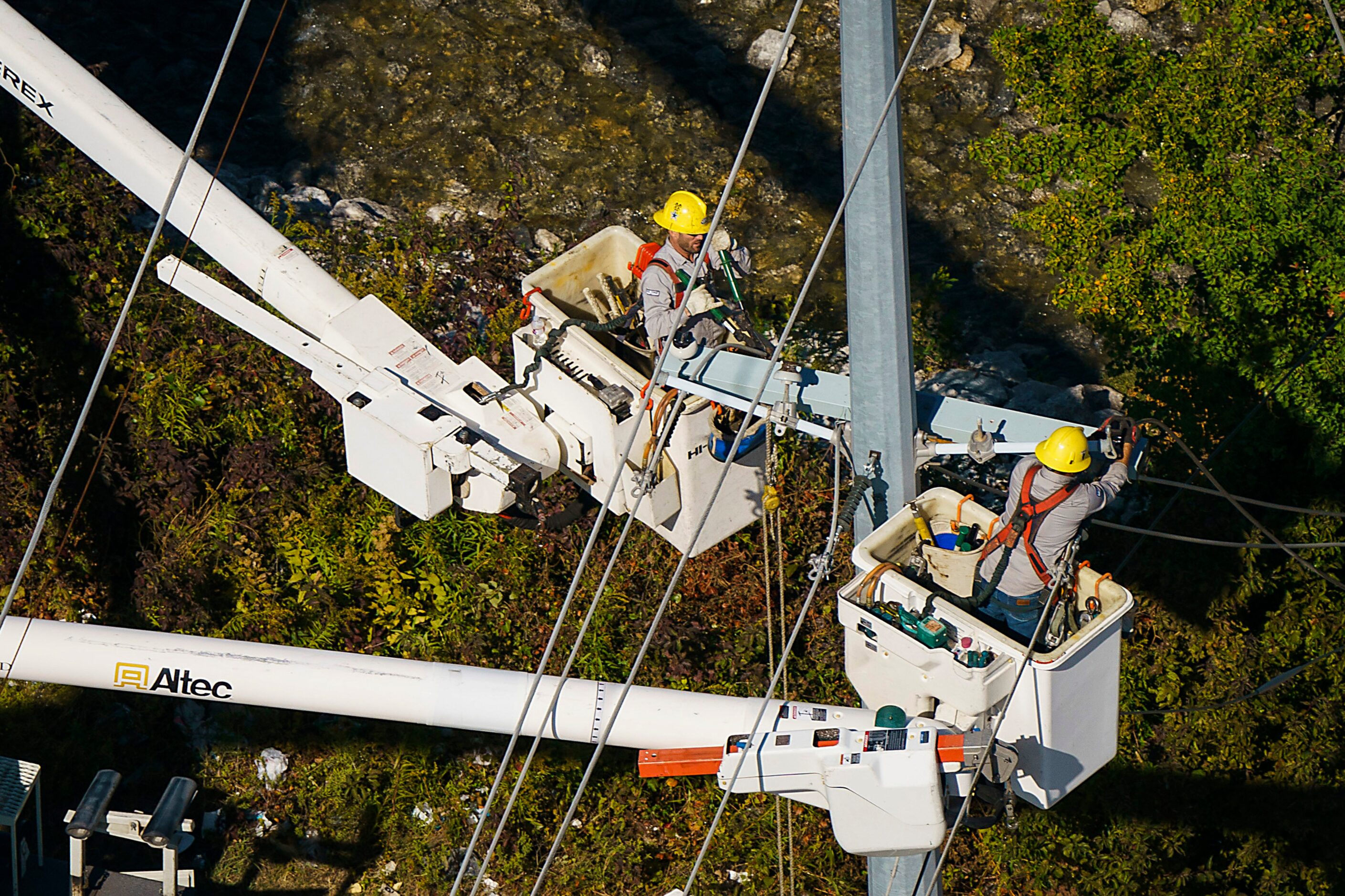 Crews work on power restoration from tornado damage on Monday, Oct. 21, 2019, in Garland.