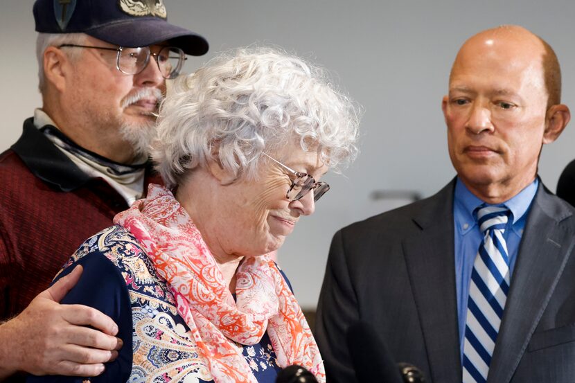 Ann Brooks, oldest daughter of victim Mary Brooks, center, gets emotional during a news...