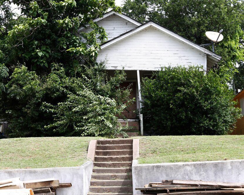 This is the house at 1121 E. Ninth St. that will be demolished, because the Landmark...