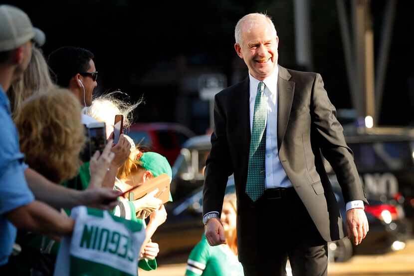 FILE - Stars general manager Jim Nill is welcomed by fans on the green carpet at American...