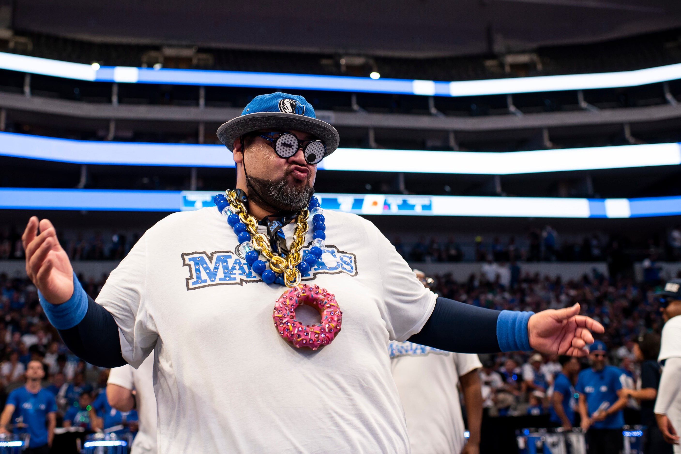 A Mavs ManiAAC dances to get the fans excited during the Dallas Mavericks official watch...