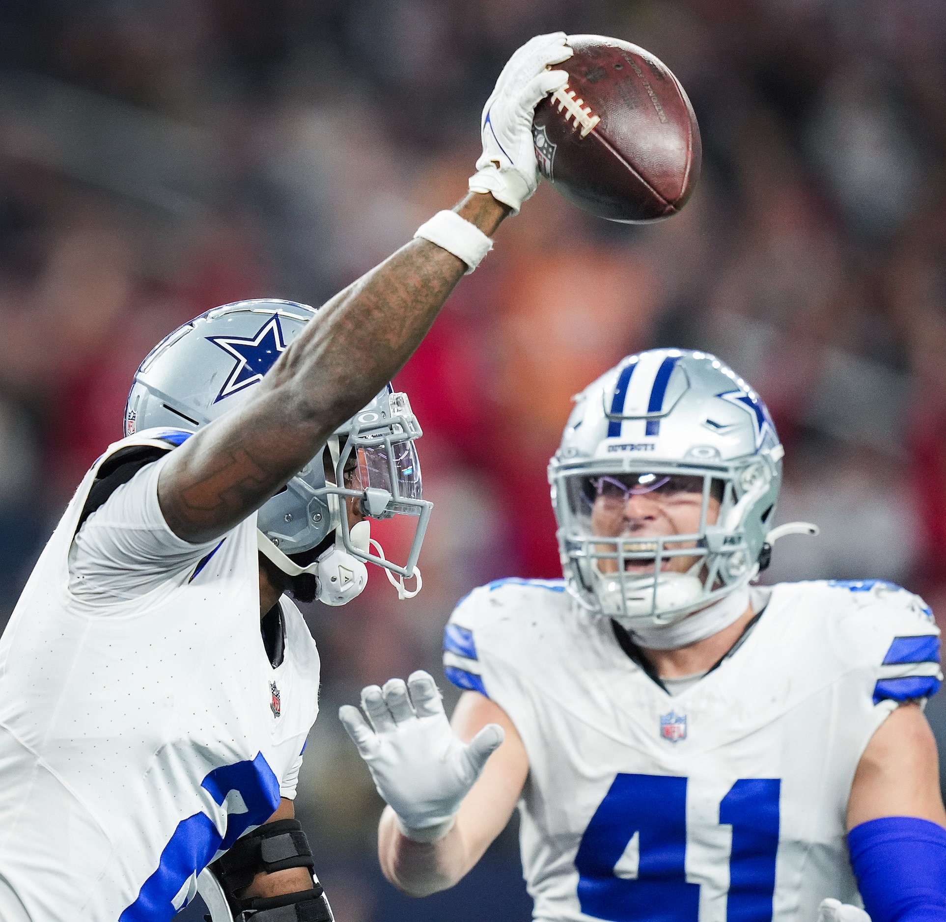 Dallas Cowboys cornerback Jourdan Lewis (2) celebrates with linebacker Nick Vigil (41) after...