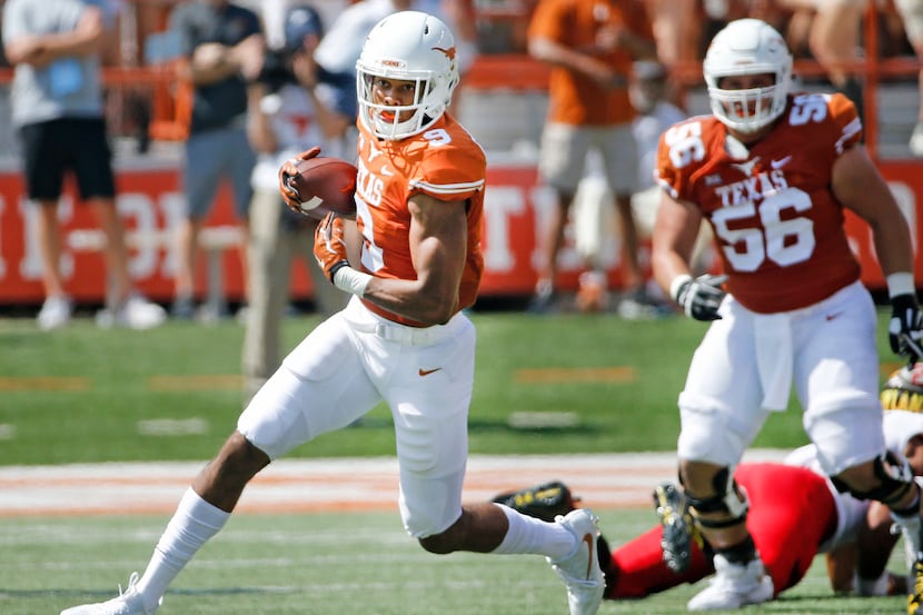 Texas Longhorns wide receiver Collin Johnson (9) runs for yardage after a pass catch during...