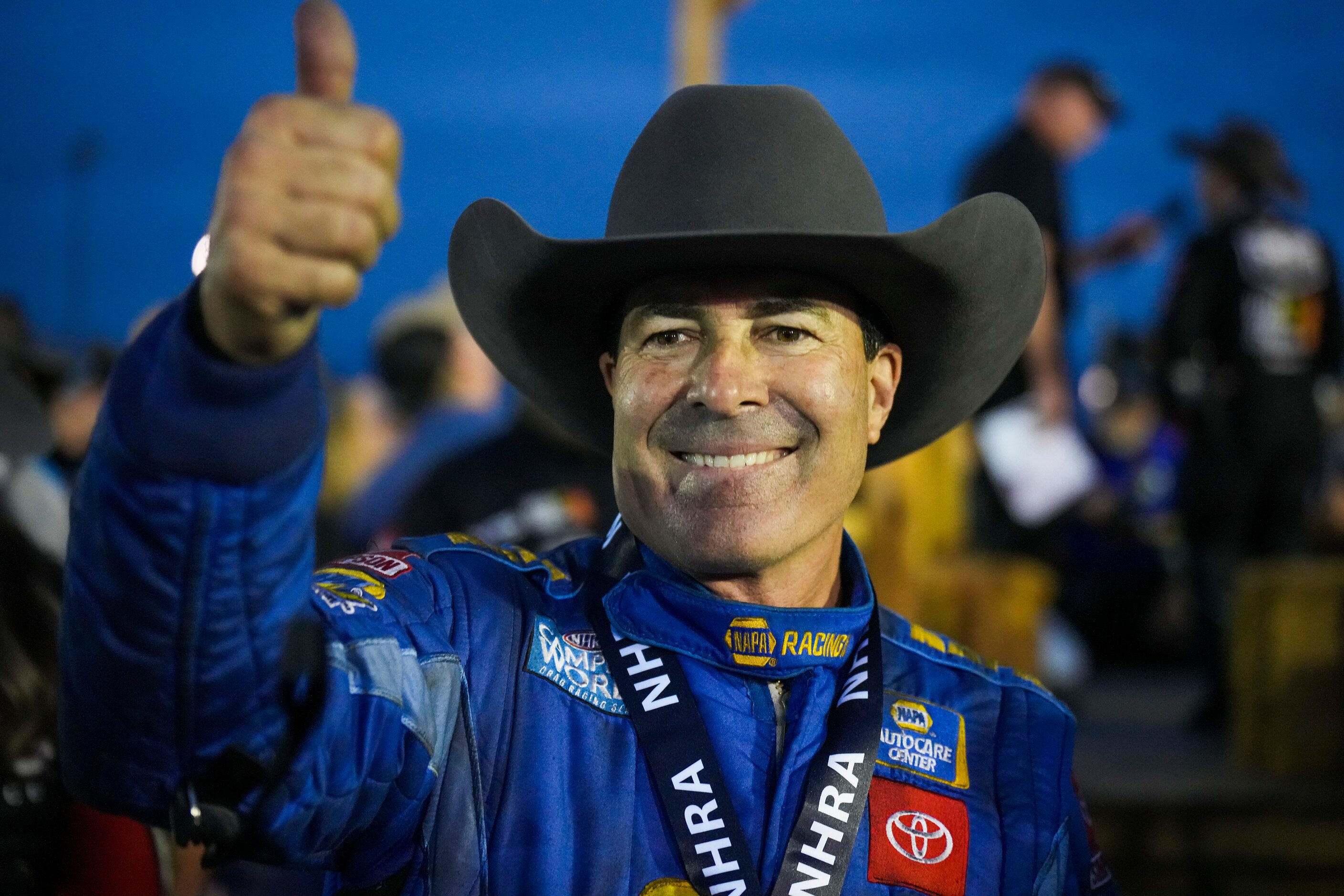 Ron Capps celebrates after his Funny Car finals victory at the Texas NHRA FallNationals auto...