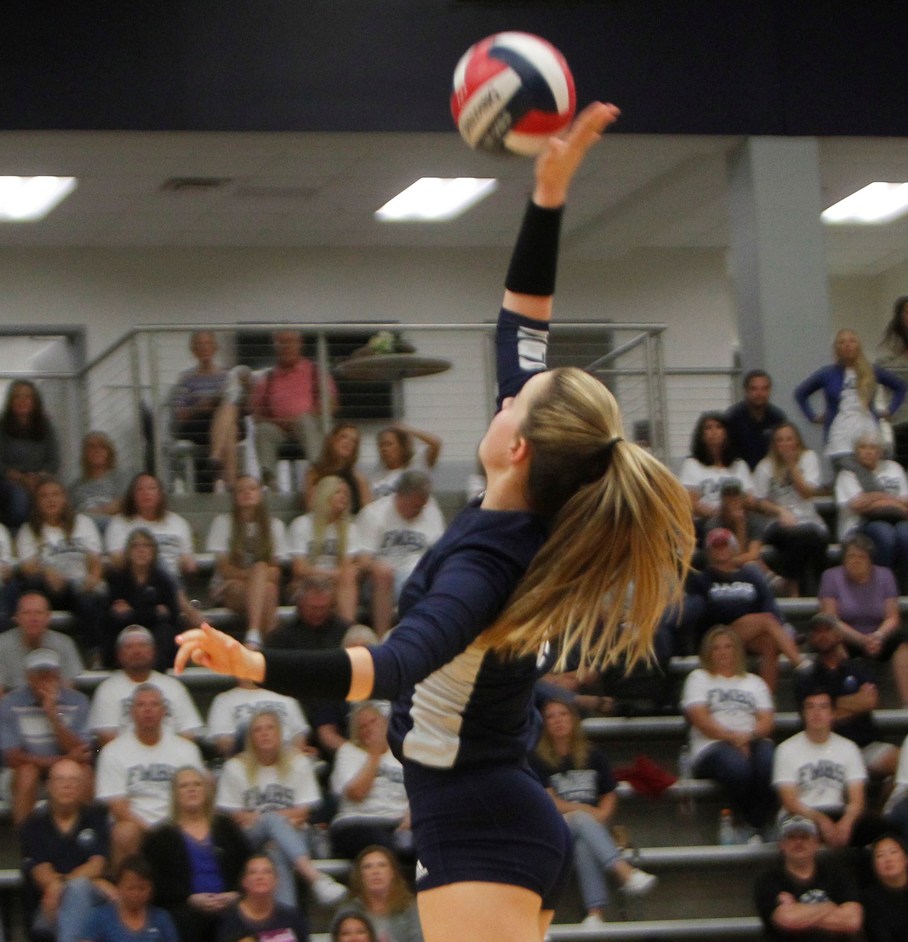 Flower Mound outside hitter Cat Young (11) returns the ball during the first set of their...