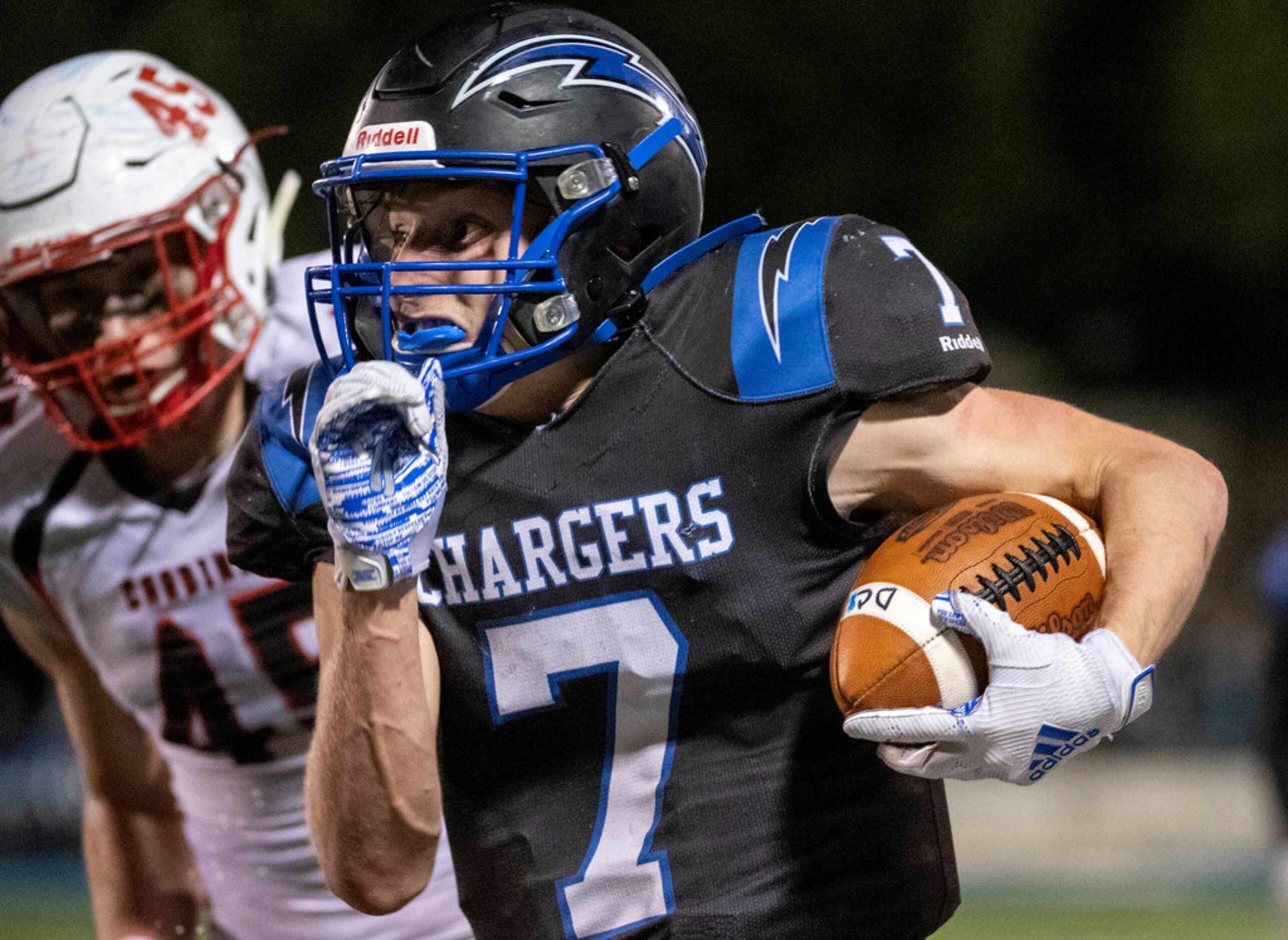 Dallas Christian junior running back TJ King (7) pulls away from Fort Worth Christian senior...