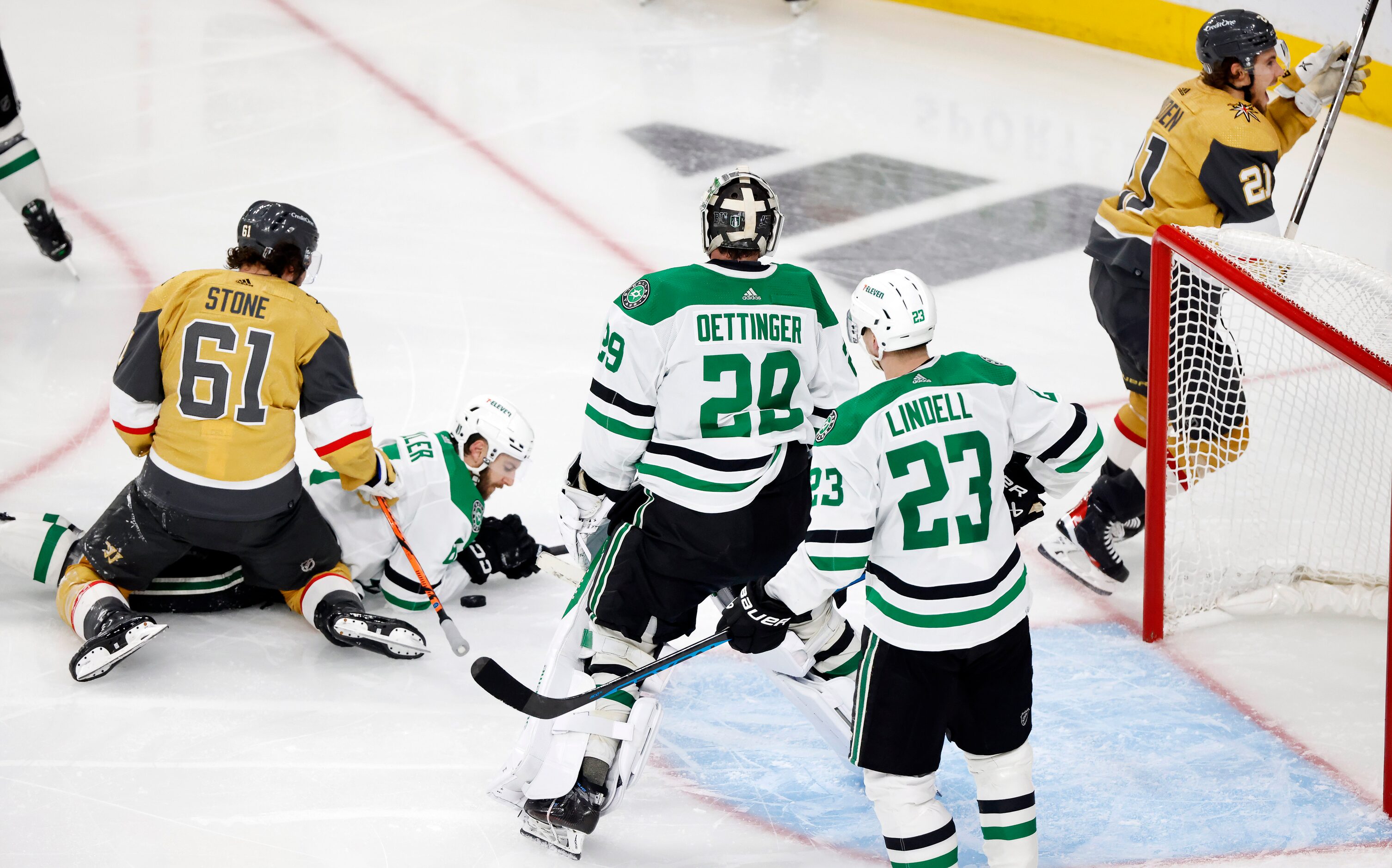 Dallas Stars goaltender Jake Oettinger (29) can only watch as Vegas Golden Knights players...