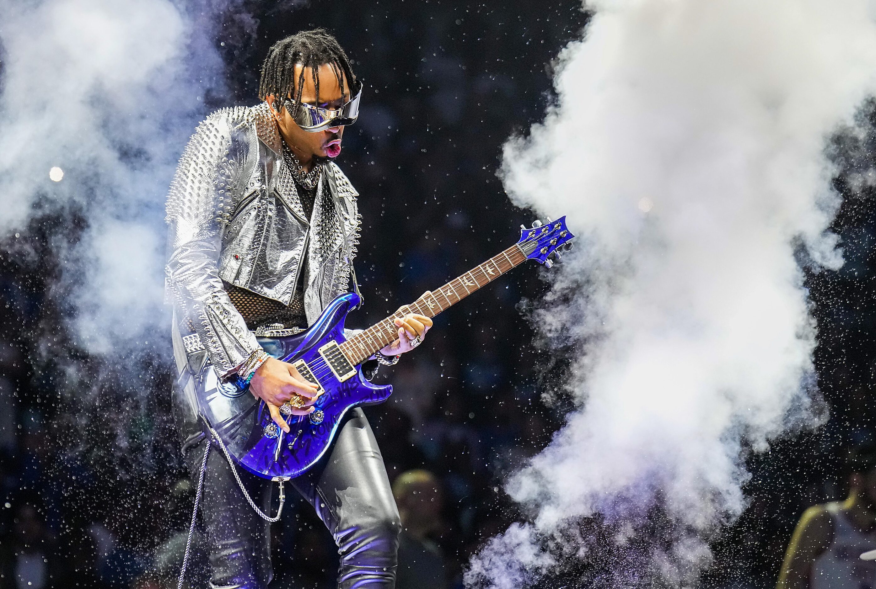 Guitarist Justin Lyons plays during player introductions before Game 3 of an NBA basketball...