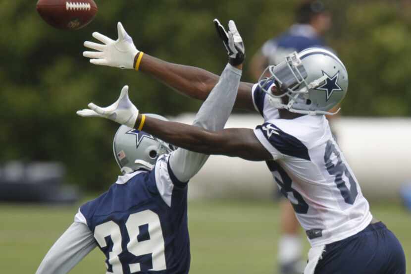 Receiver Dez Bryant (88) fails to catch a pass while he is defended by cornerback Brandon...