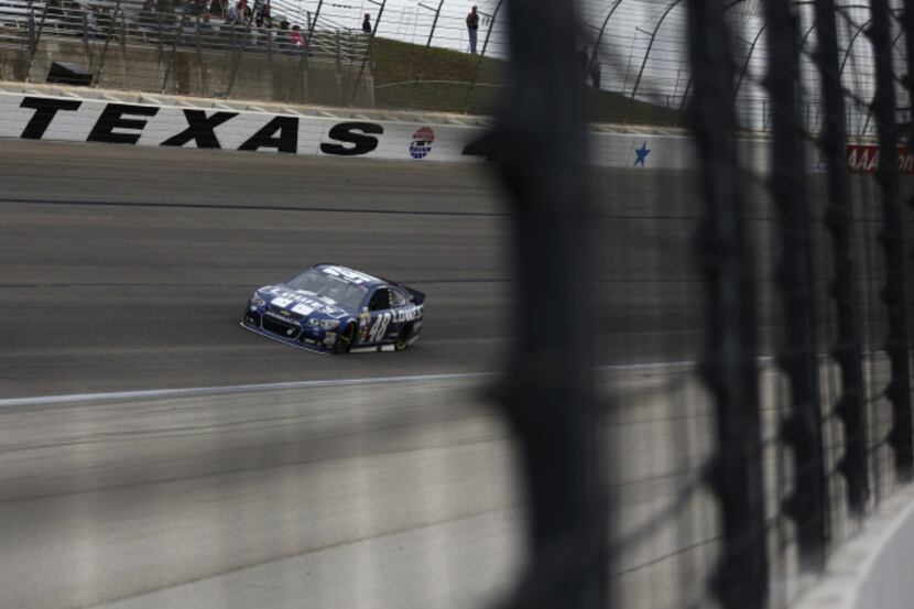 Sprint Cup Series driver Jimmie Johnson (48) leads the race during the NASCAR Sprint Cup...
