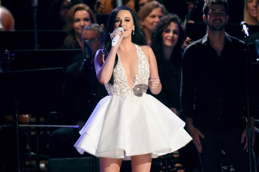 Kacey Musgraves performs during a tribute to Dolly Parton at the 50th annual CMA Awards at...