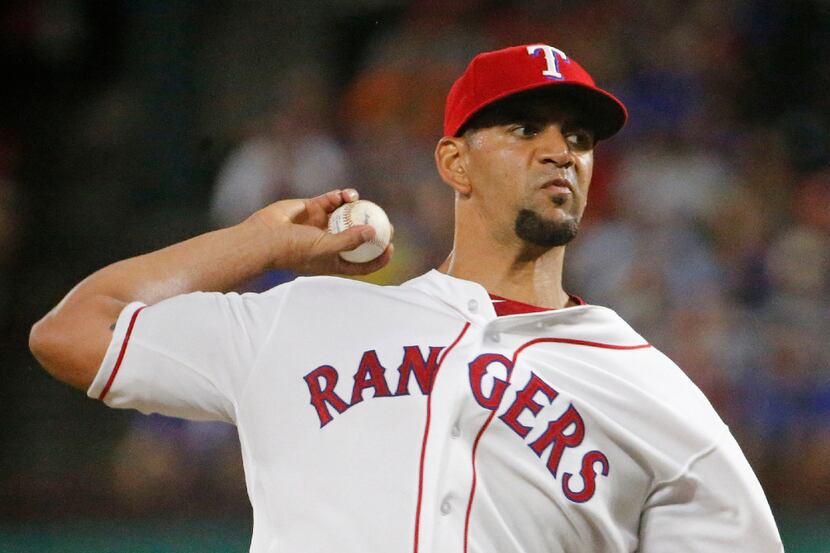 Texas Rangers starting pitcher Tyson Ross (44) throws a fifth-inning pitch during the...