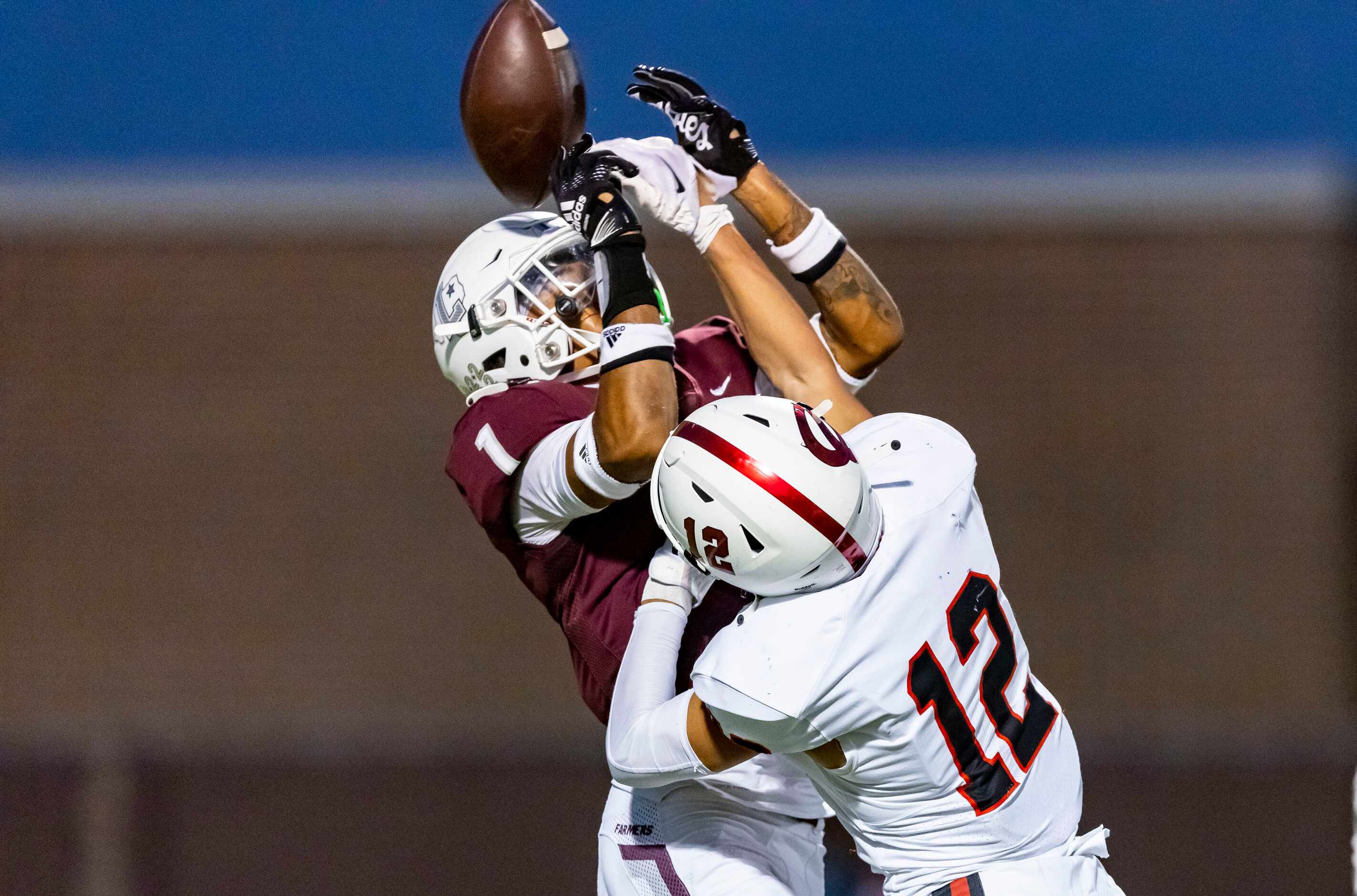 Lewisville junior defensive back Jaydan Hardy (1) breaks up a pass intended for Coppell...