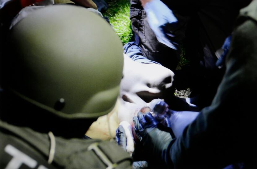 In this Friday, April 19, 2013 Massachusetts State Police photo, tactical emergency medical...