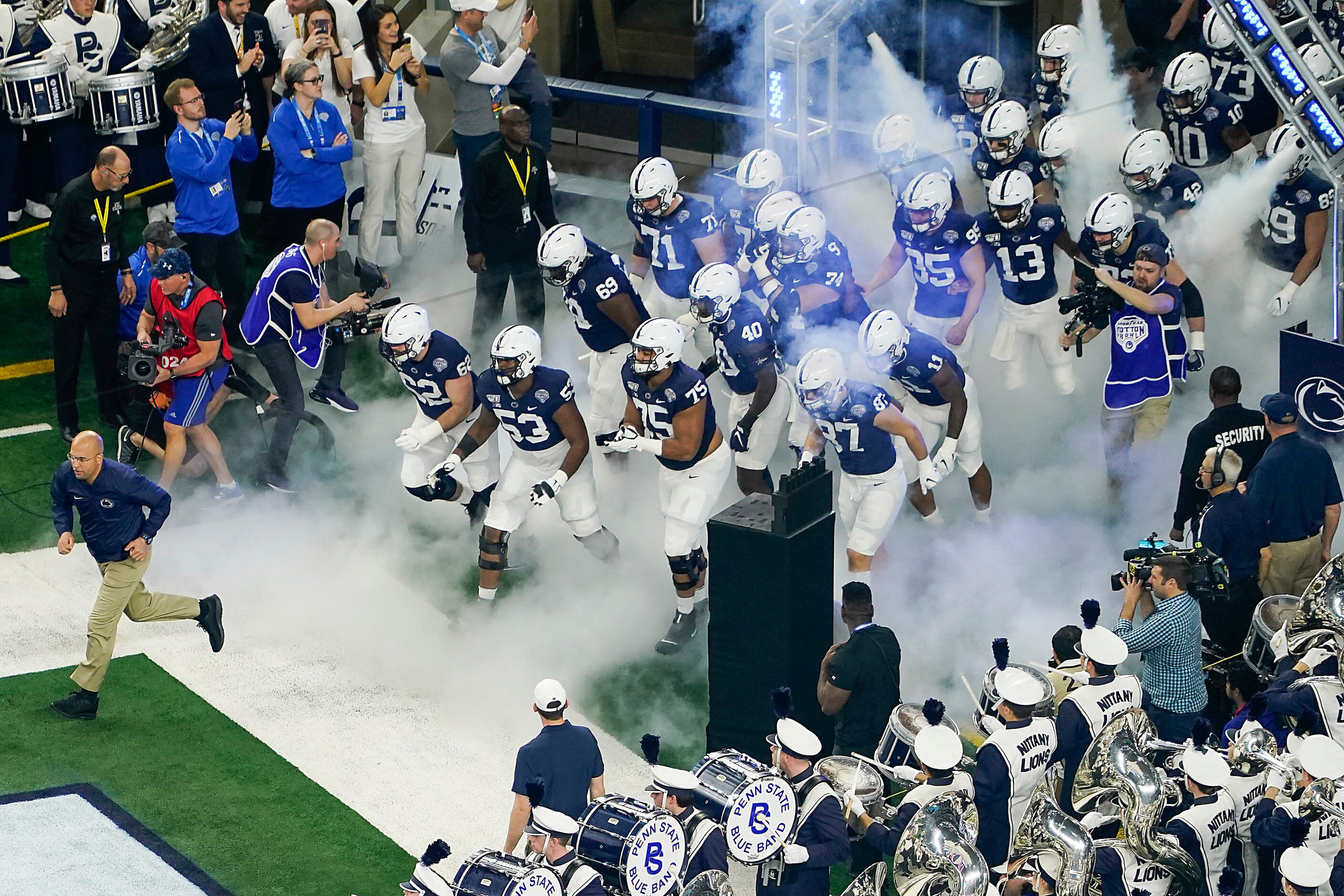 Penn State head coach James Franklin leads his team onto the field before the Goodyear...