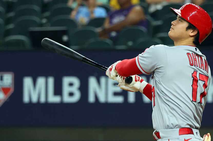 Los Angeles Angels' Shohei Ohtani watches his two-run home run in the eighth inning in a...