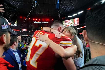 Taylor Swift embraces Kansas City Chiefs tight end Travis Kelce after the NFL Super Bowl 58...