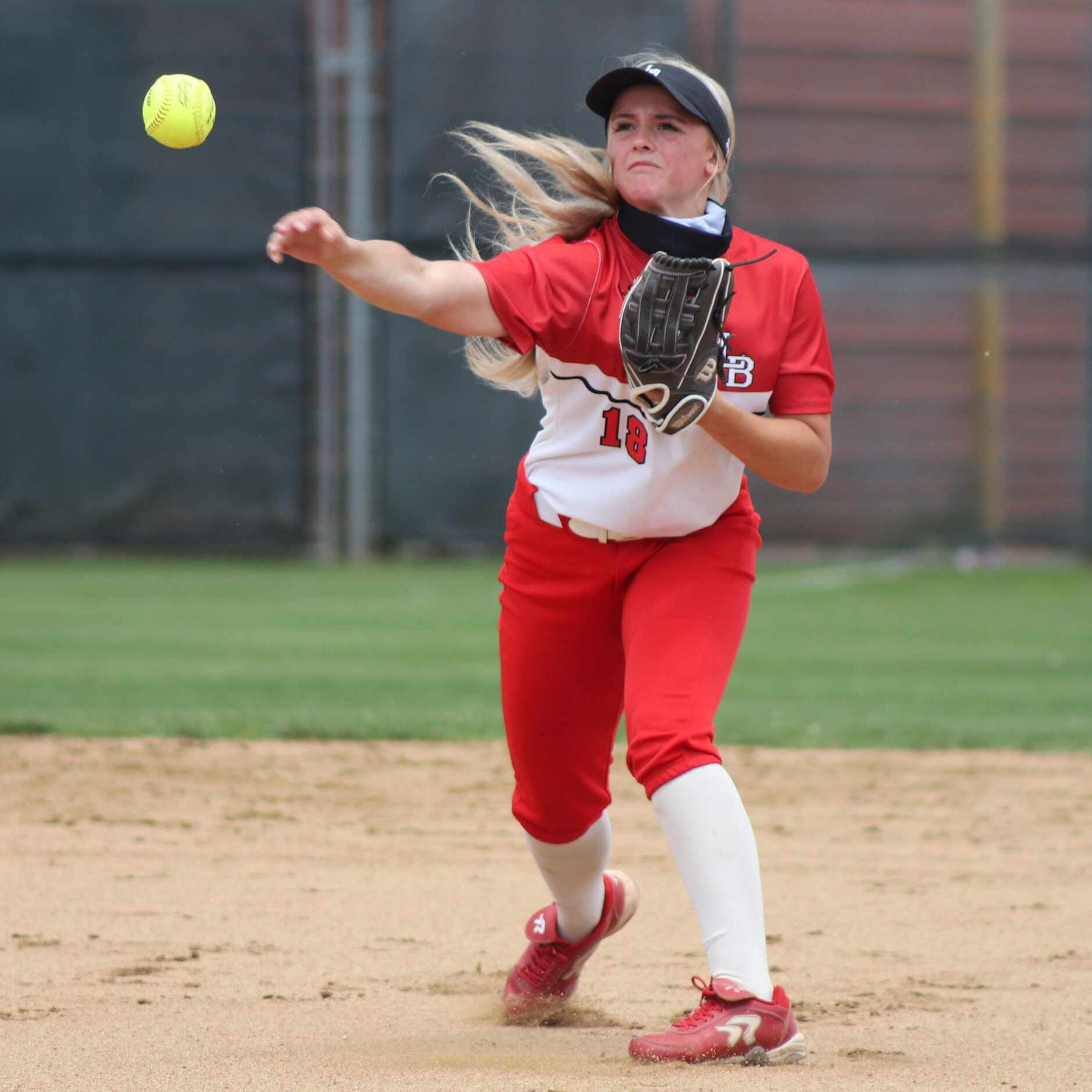 Mansfield Legacy shortstop Hope Lusk (18) throws to first for an out during a softball Class...
