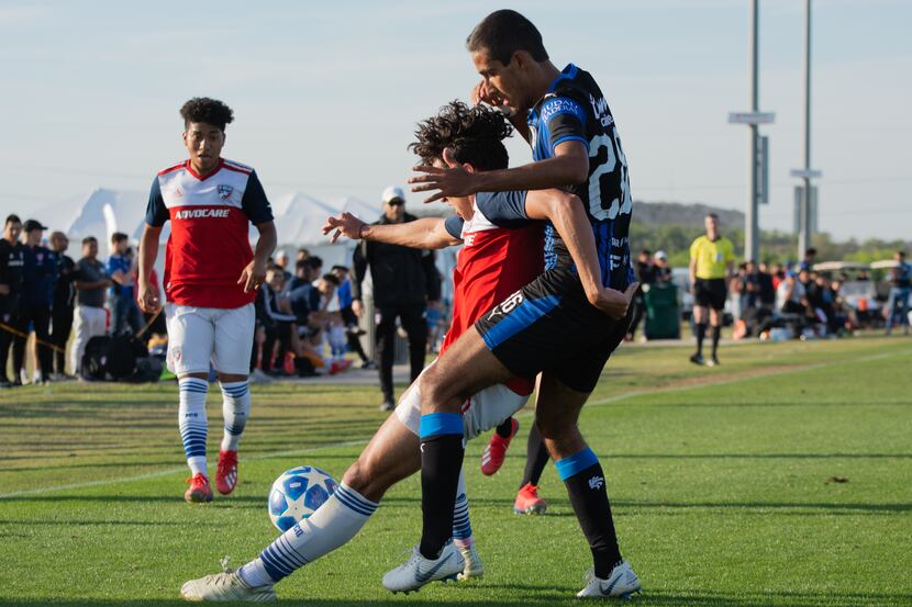 FC Dallas U19 Johan Gomez shields off a Queretaro defender during the 2019 Dallas Cup at...