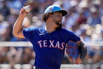 Texas Rangers starting pitcher Yerry Rodriguez throws in the first inning of a spring...