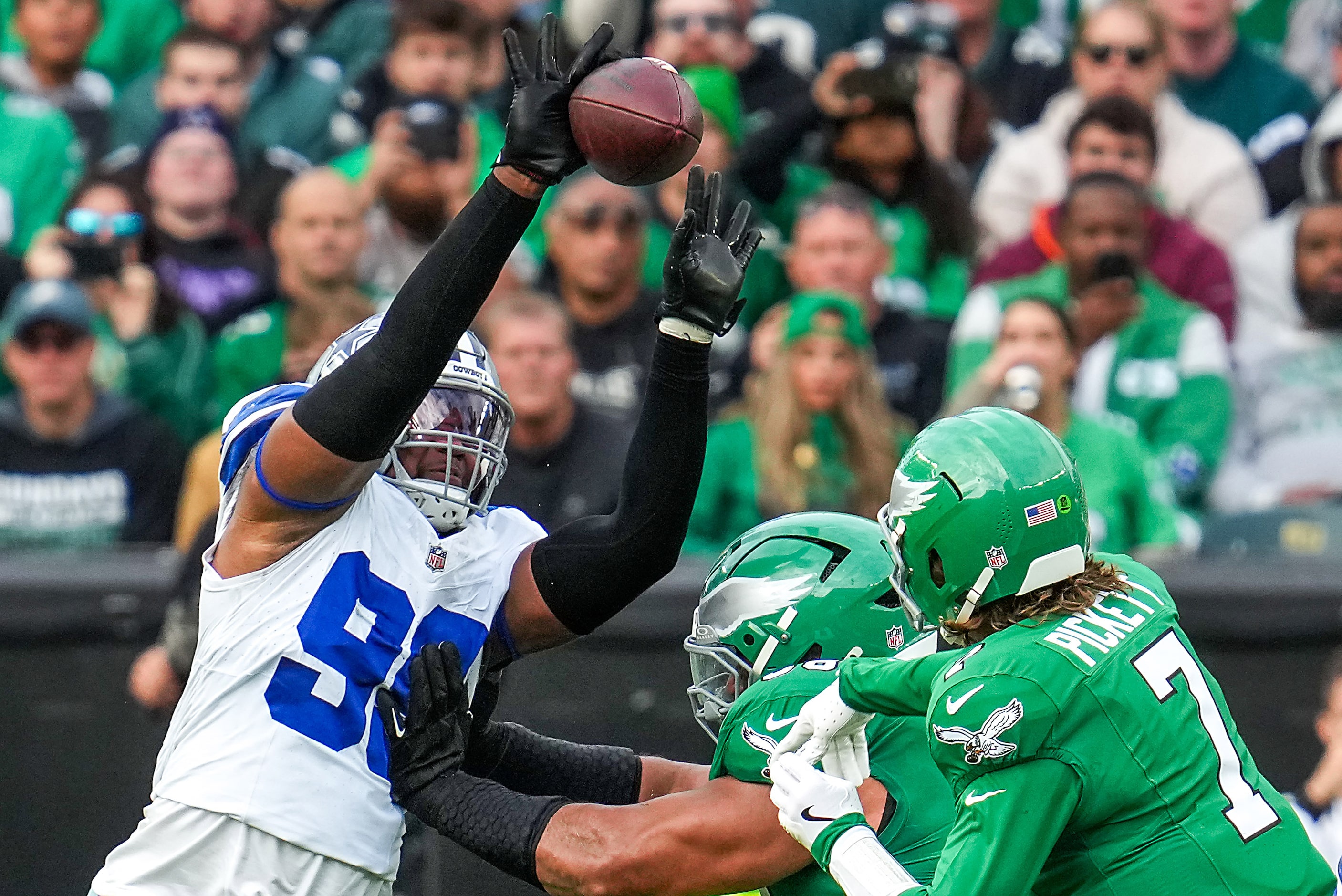 Dallas Cowboys defensive end Chauncey Golston (99) knocks down a pass by Philadelphia Eagles...