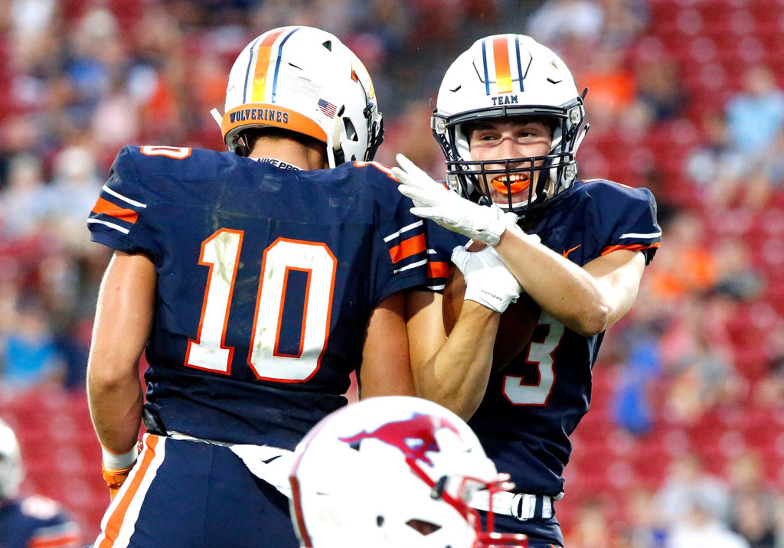 Frisco Wakeland High School wide receiver Peyton Lewis (10) congratulates Frisco Wakeland...